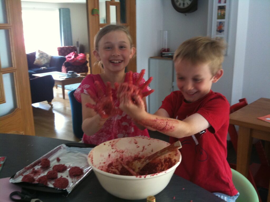 girl and boy making sweets